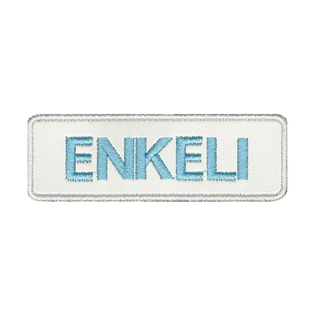 Nahkamerkki, valkoinen, teksti: enkeli.