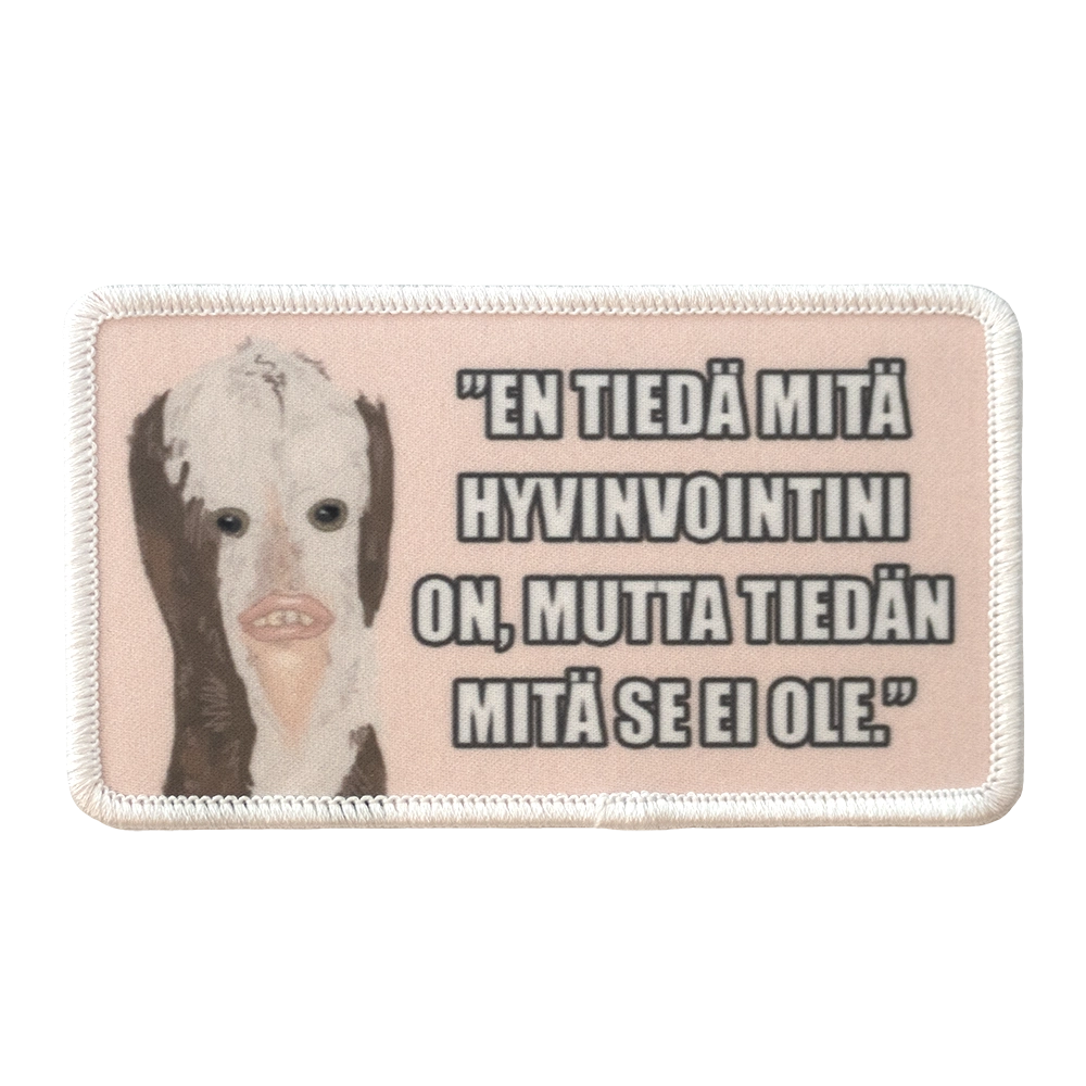 Painettu haalarimerkki, hahmo, teksti: En tiedä mitä hyvinvointini on, mutta tiedän mitä se ei ole.