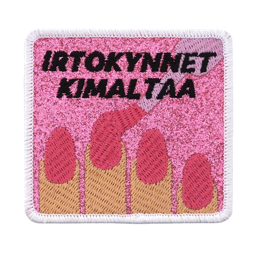 Brodeerattu merkki glitterkankaalla, kynsilakkaa, teksti: Irtokynnet kimaltaa.