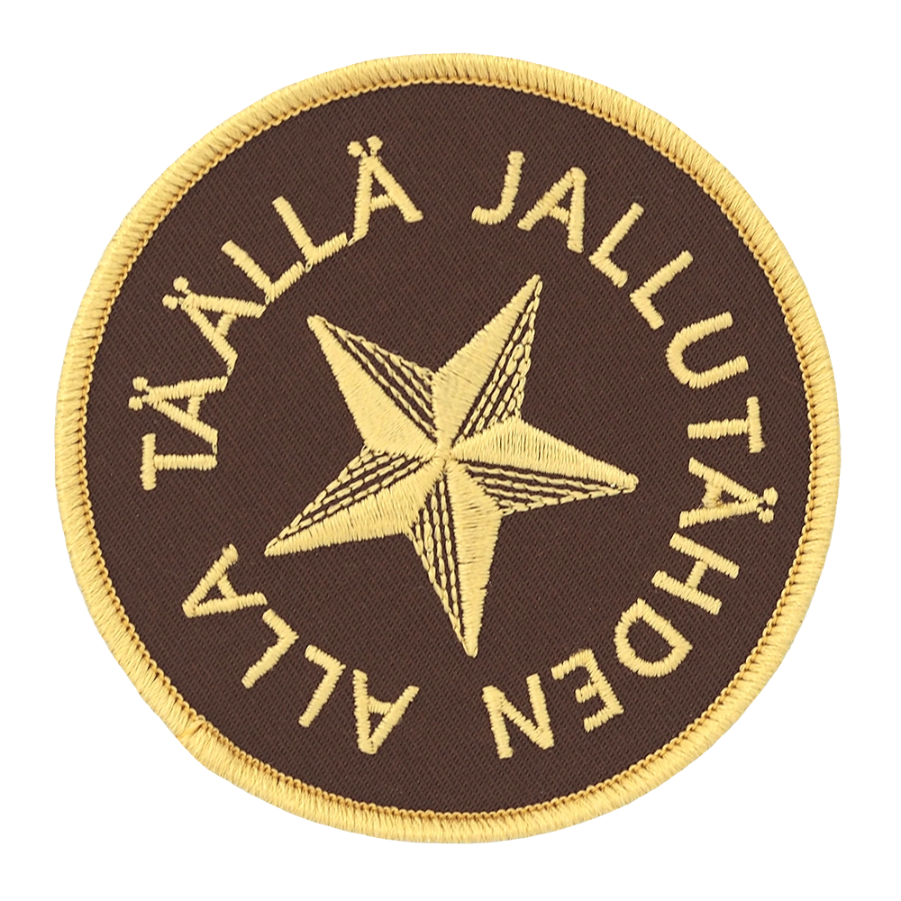 Brodeerattu haalarimerkki, jallutähti, teksti: Täällä jallutähden alla.
