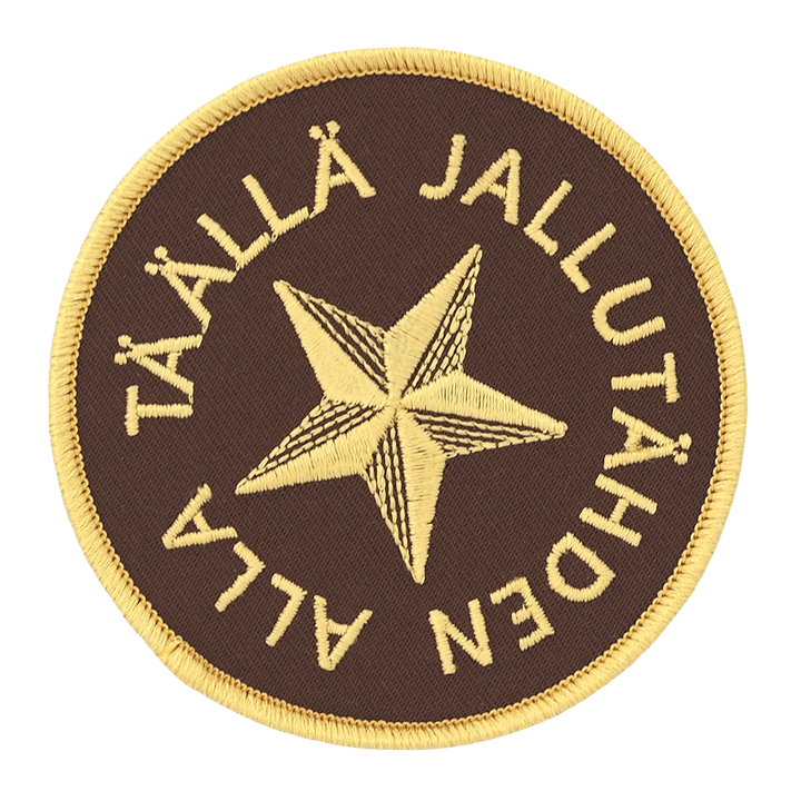 Brodeerattu haalarimerkki, jallutähti, teksti: Täällä jallutähden alla.
