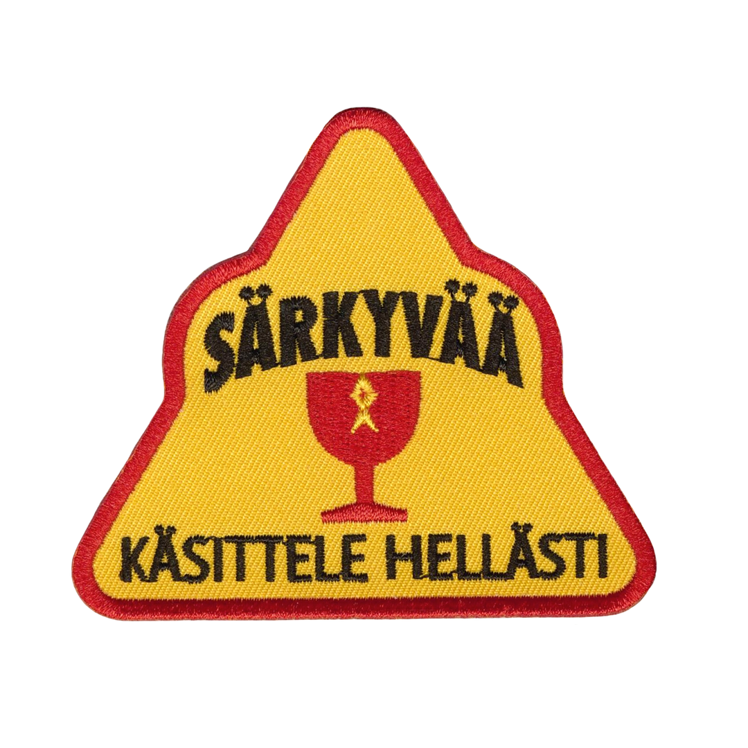 Brodeerattu kangasmerkki, särkyvää.