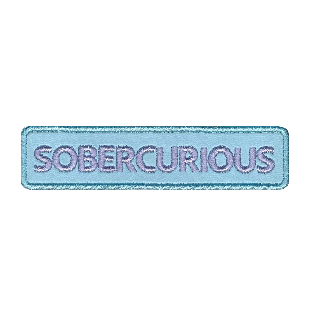 Nahkamerkki, vaaleansininen, teksti: sobercurious.