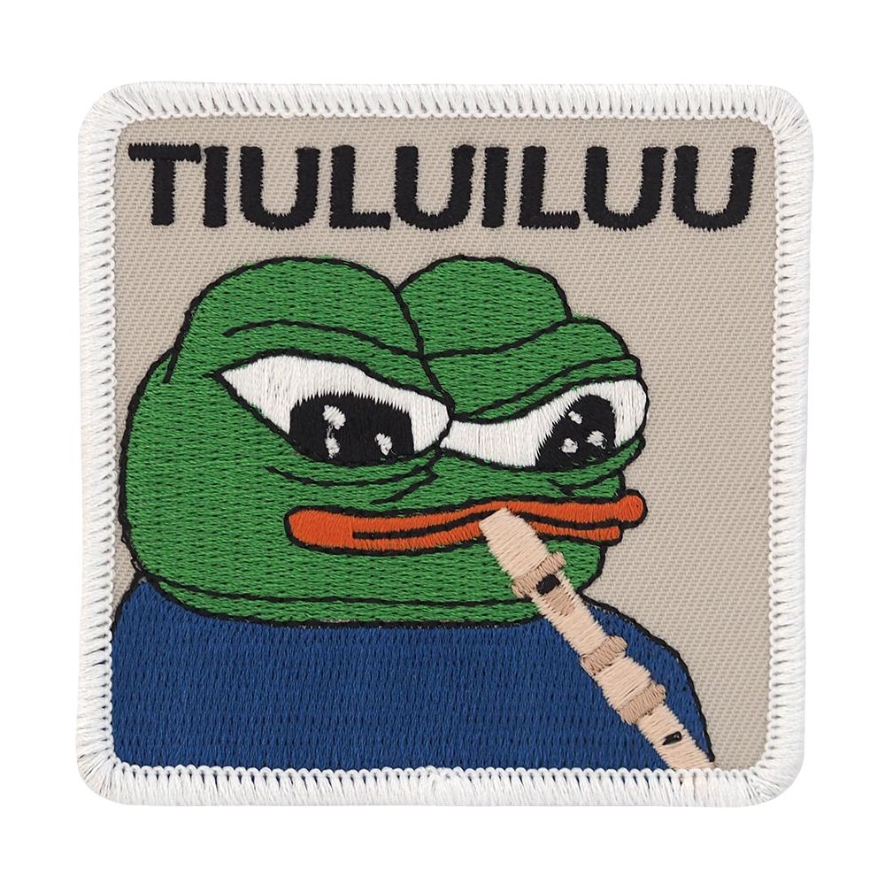 Brodeerattu Apustaja-haalarimerkki, nokkahuilu.