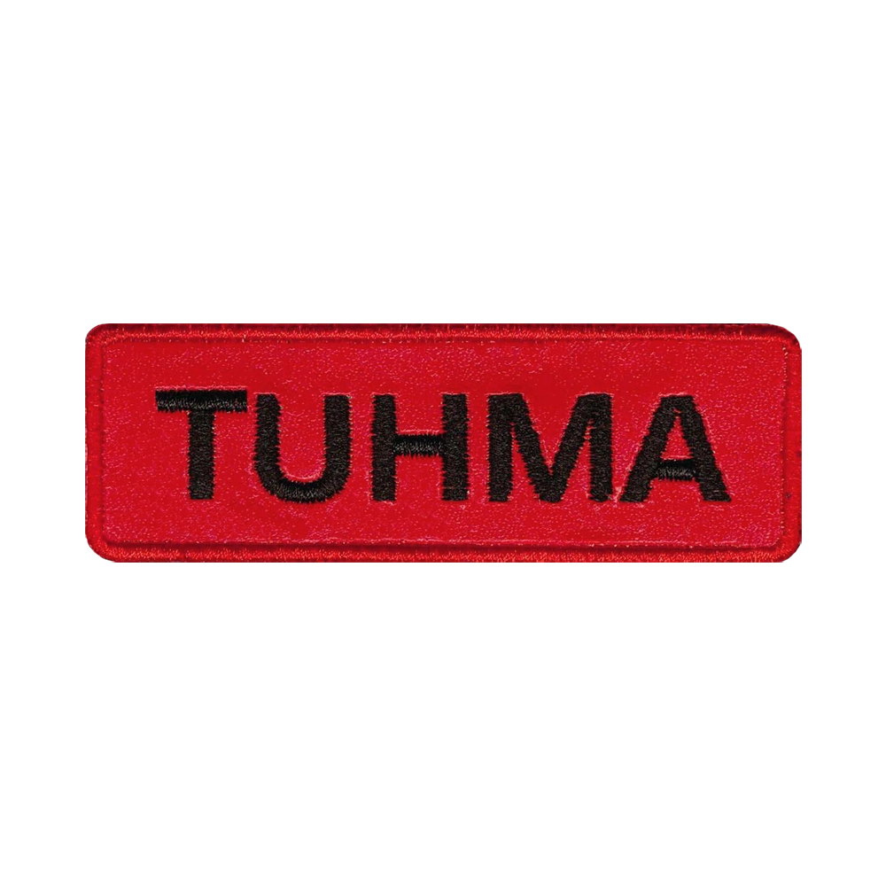 Nahkamerkki, punainen, teksti: tuhma.