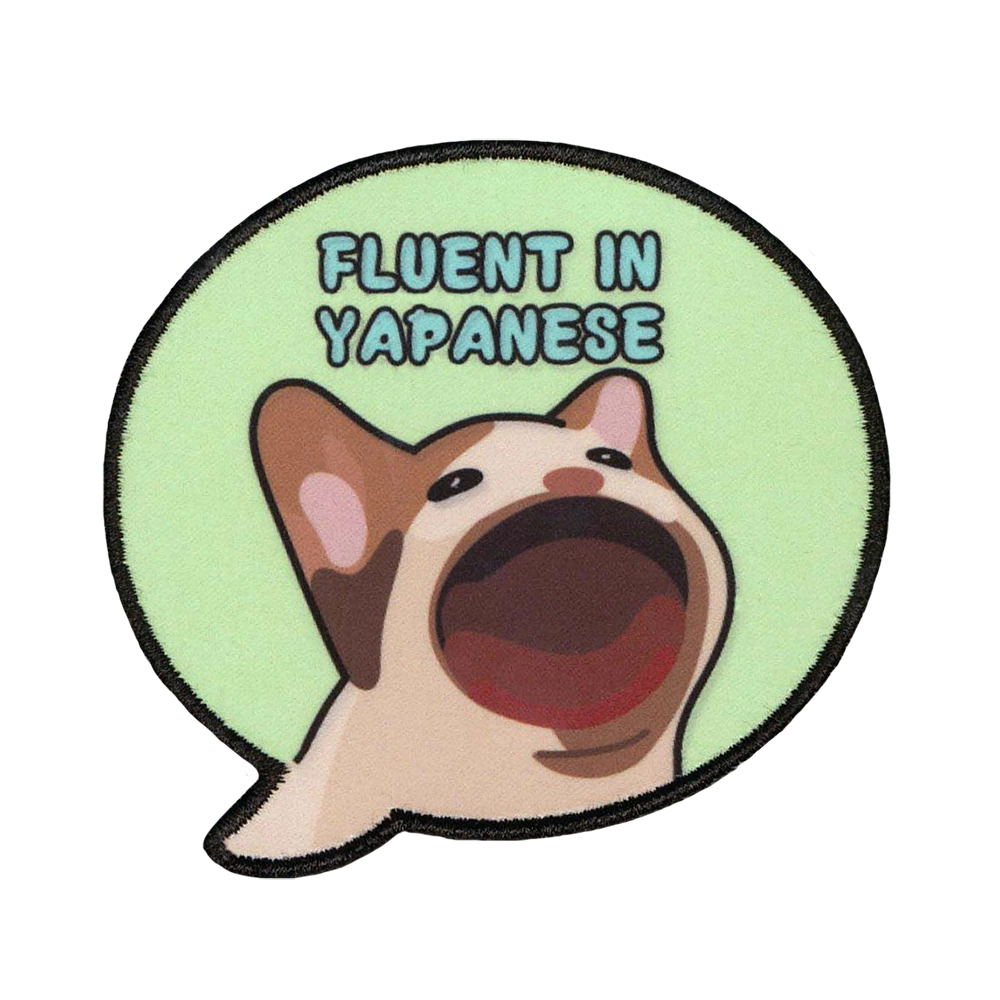 Painettu haalarimerkki, teksti: Fluent in yapanese.